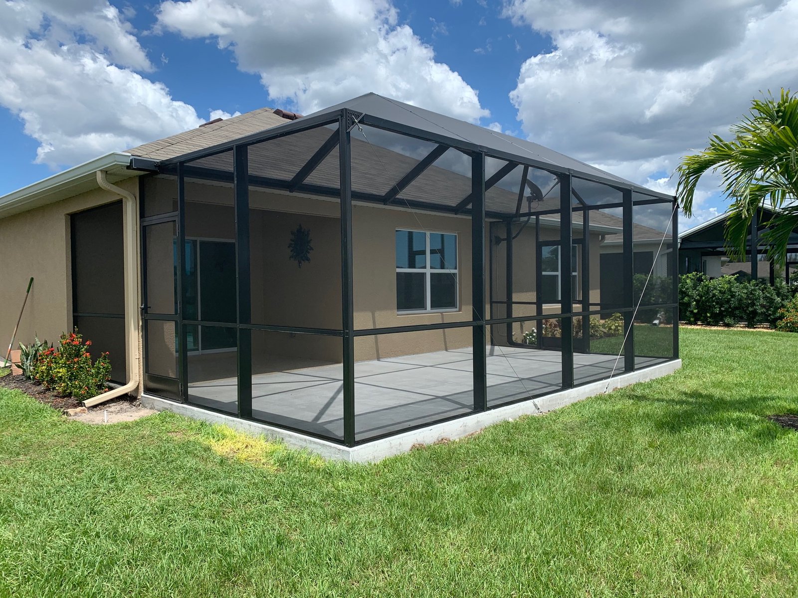 Completed patio enclosure installation in Davie, FL on residential backyard patio